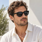 Mann trägt die schwarze polarisierte Sonnenbrille im Freien