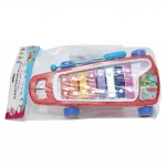 Klassisches xylophon-ziehtier in gelber verpackung mit bunten klangplatten.