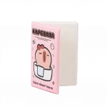 Geöffnetes rosa a5 notizbuch mit capybara-motiv.