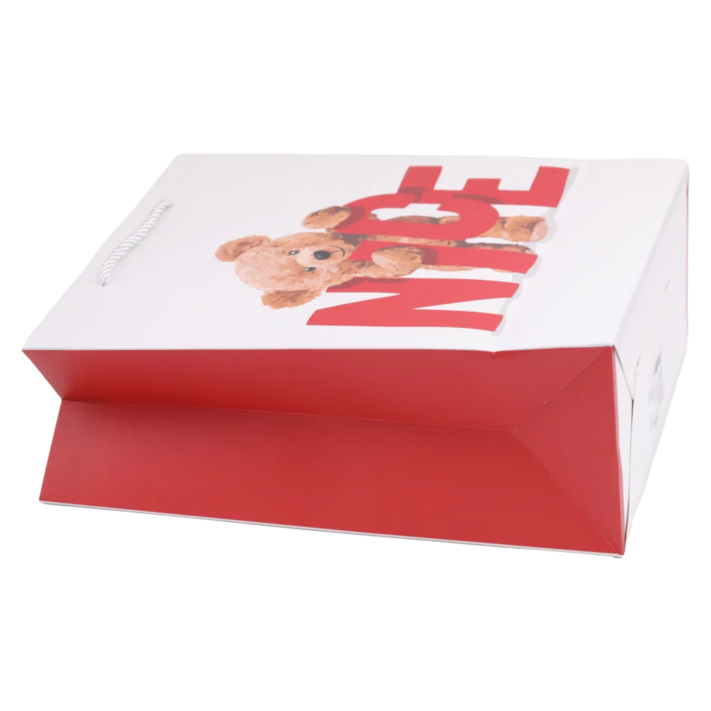 mumuso_geschenktasche_papier_baer_mittel_rot_weiss.webp MUMUSO Geschenktasche aus Papier, mittelgroß (Rot/Weiß) mit Bär – ideale Geschenkverpackung für Kindergeburtstag.